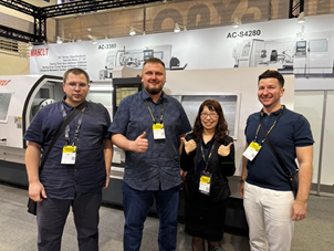 A group of people posing for a photo

Description automatically generated